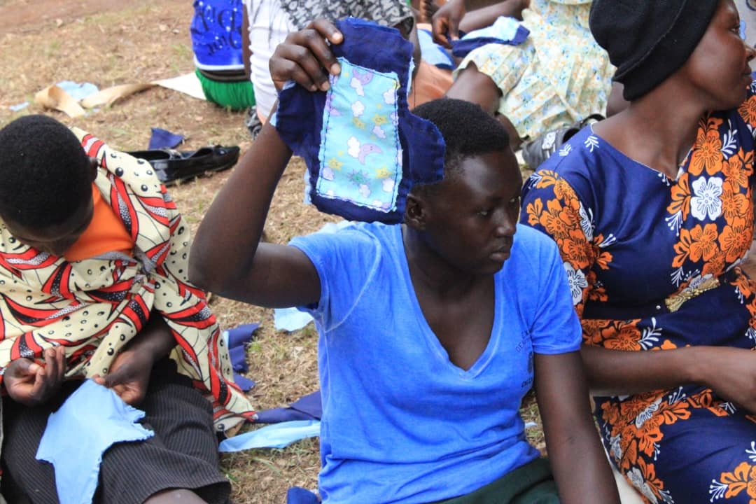 School girls learning to make reusable sanitary pads